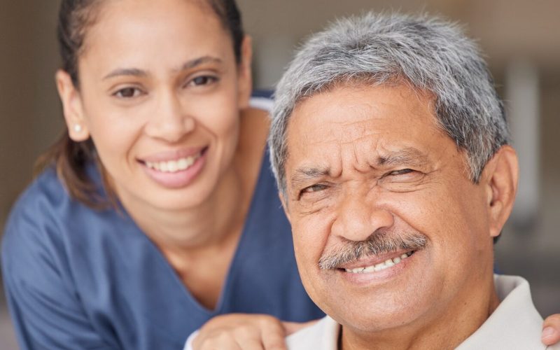 portrait-of-elderly-man-with-a-nurse-bonding-during-a-checkup-at-assisted-living-homecare-smile-.jpg